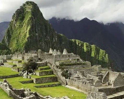 A traveller looking out over Machu Picchu and Huayna Picchu
